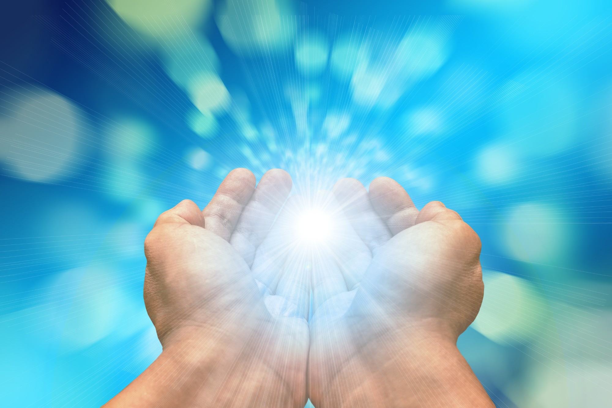 Healing light held in cupped hands